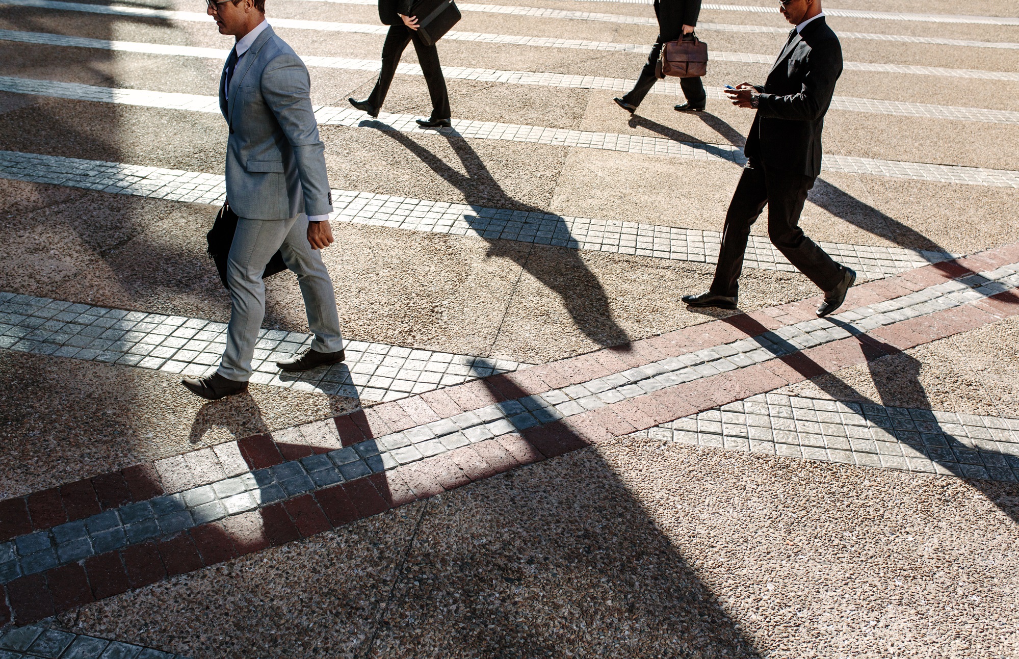 Walking People walking across crosswalk