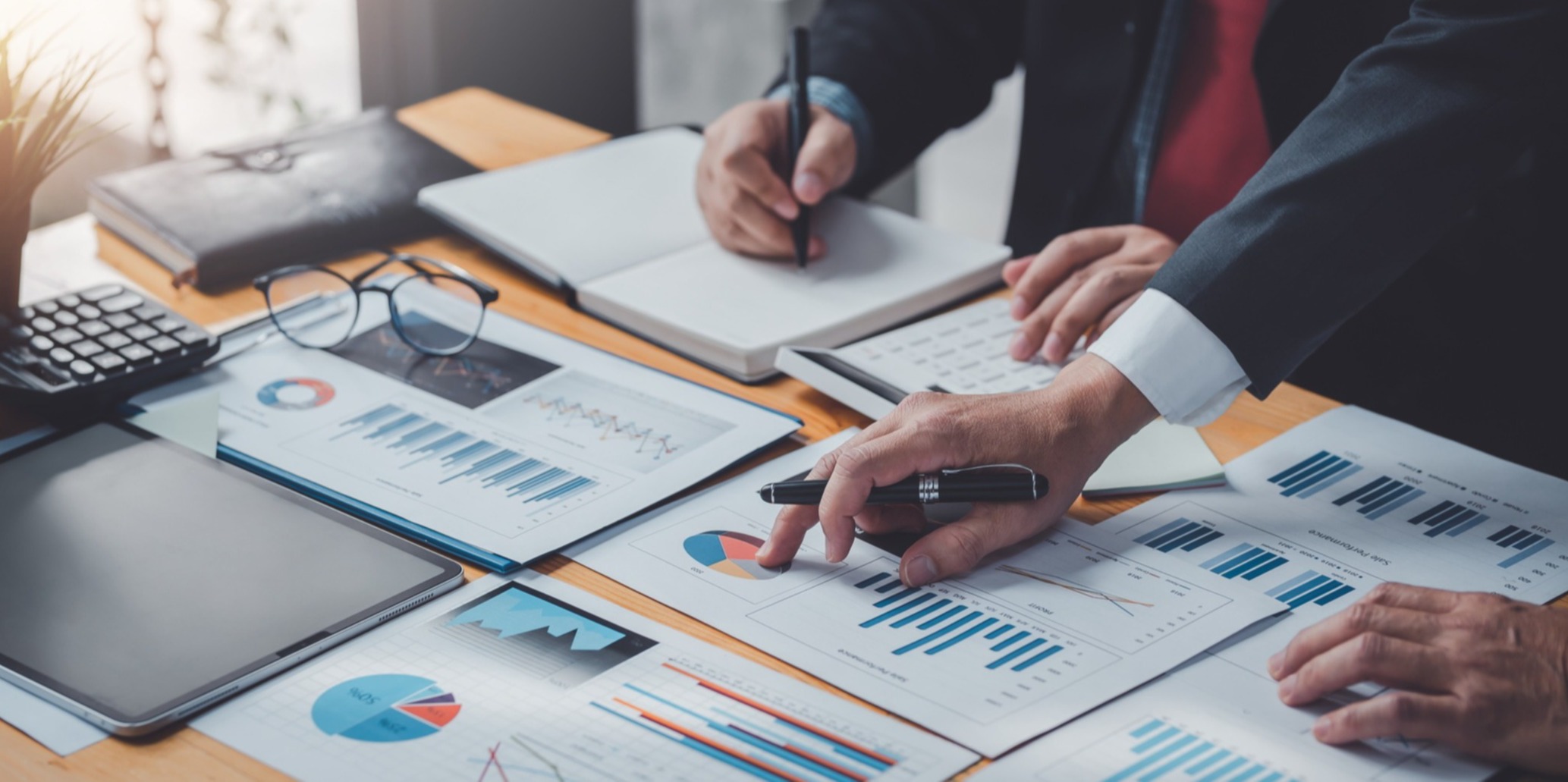 Business people analyzing charts