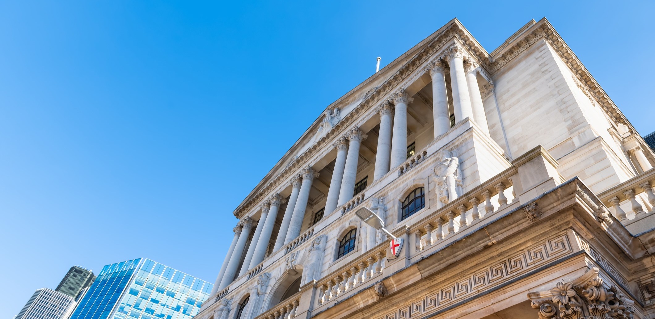 low angle photo of old bank with greek pillars