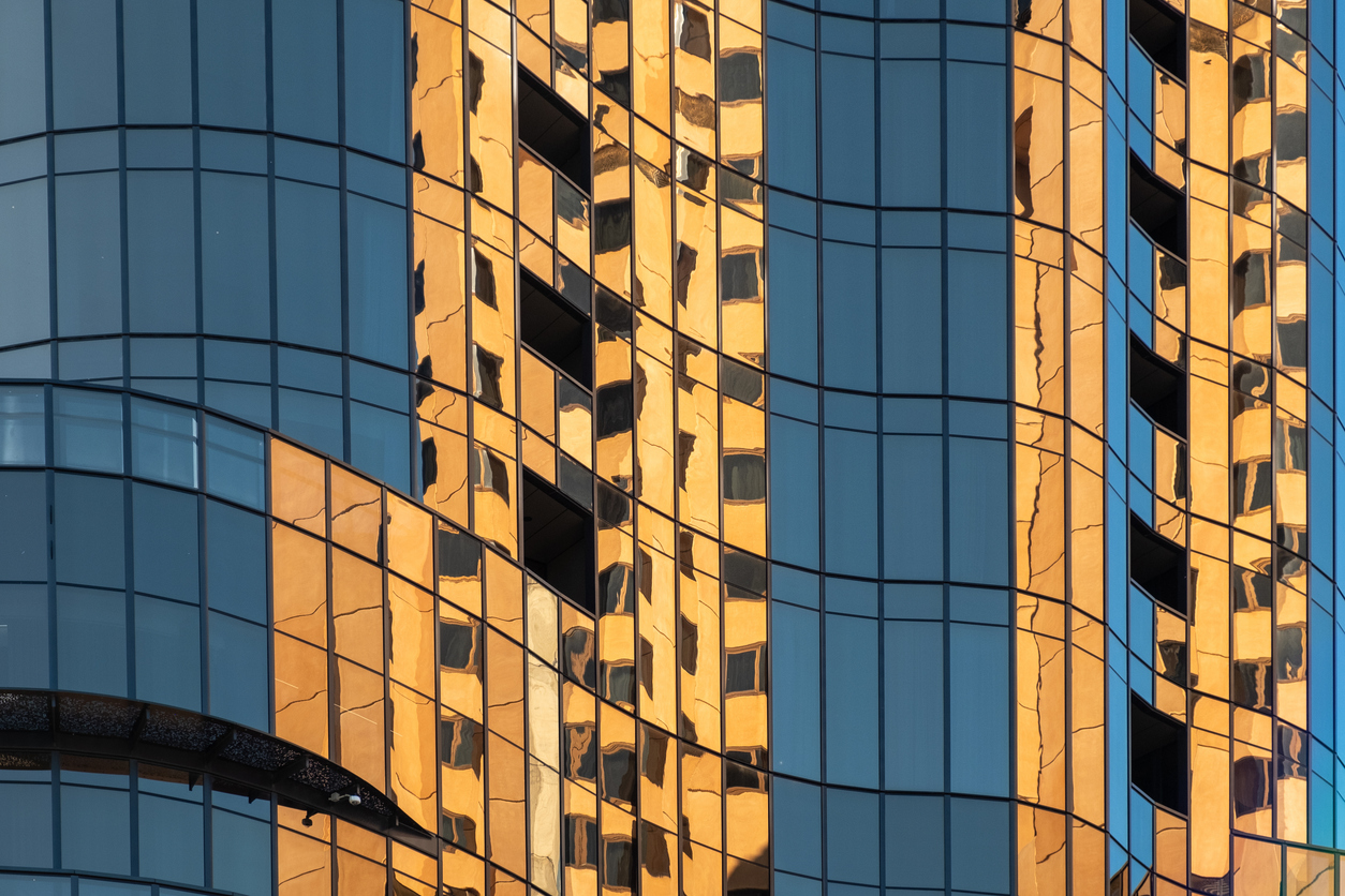 Reflection in glass of high rise skyscraper