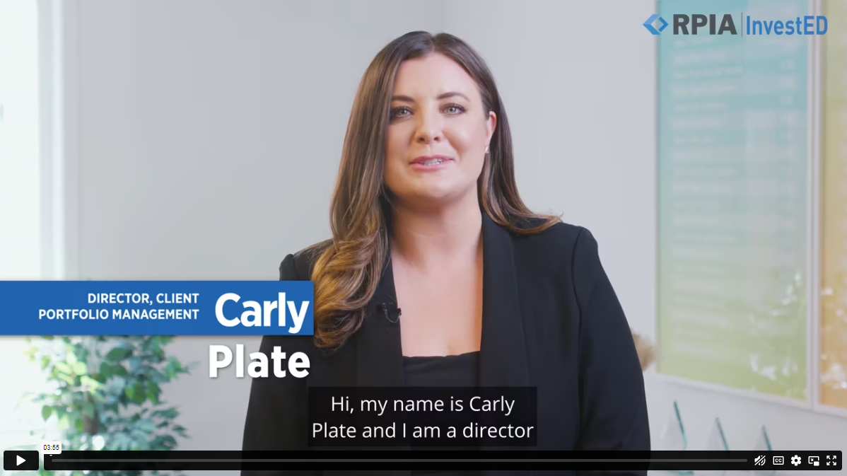 Carly Plate in a boardroom with art in the background