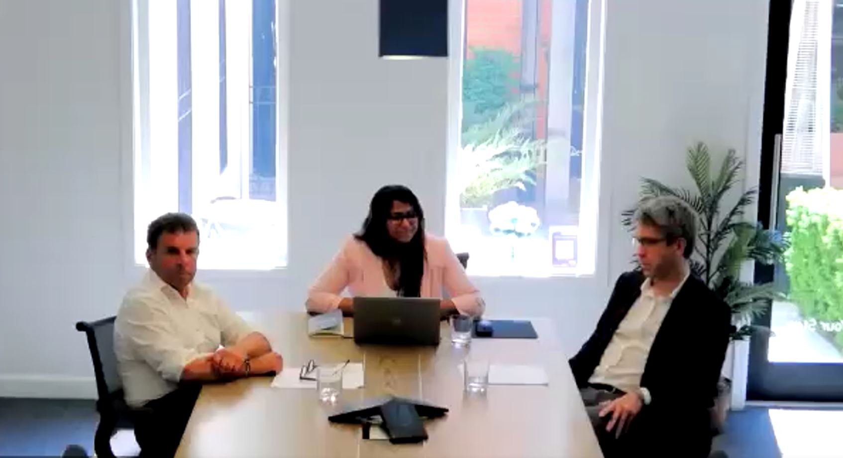 Richard Pilosof, Alex Evis, and Kripa Kapadia in the RPIA boardroom speaking on a webinar