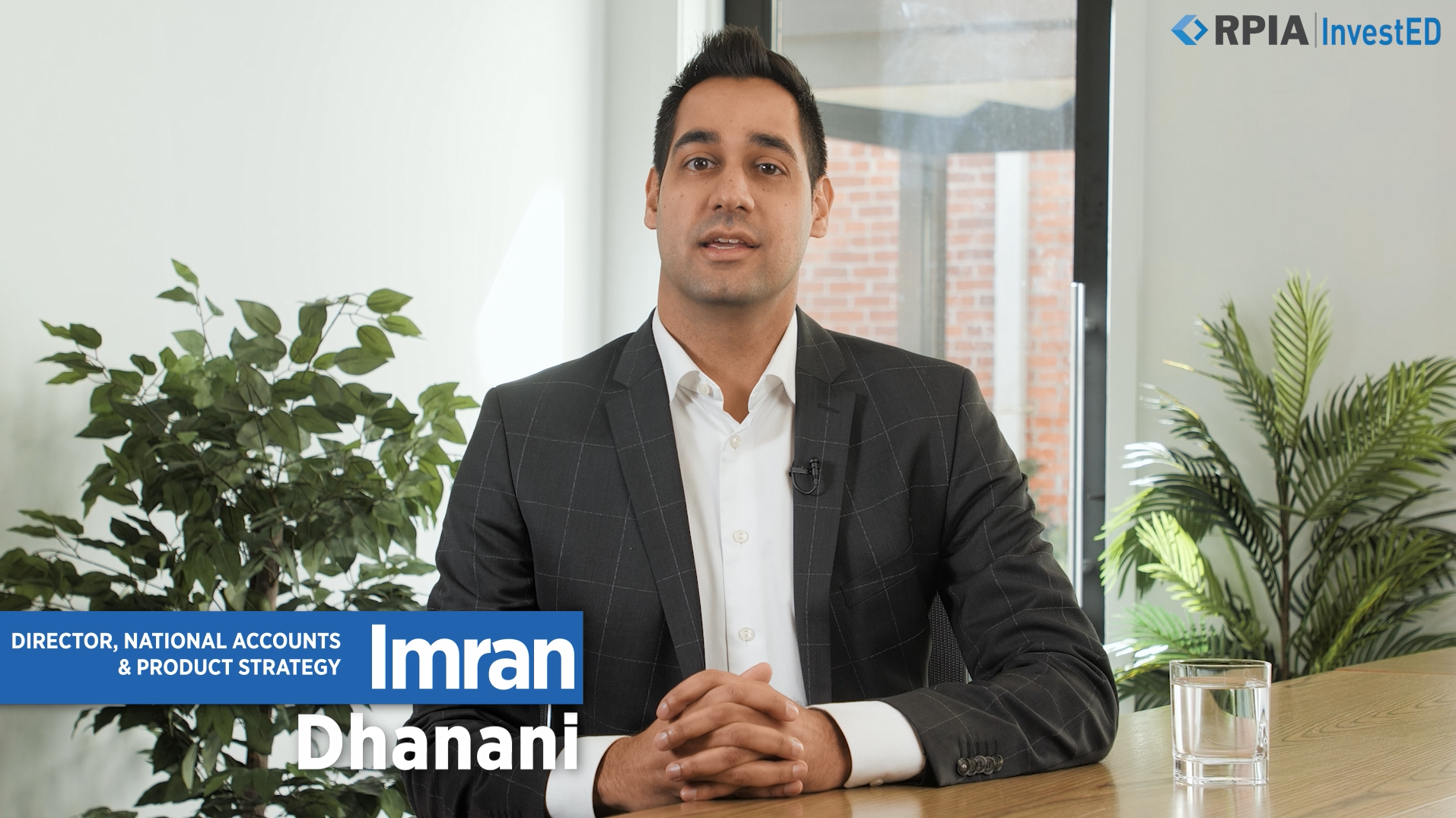 Imran Dhanani sitting in a boardroom